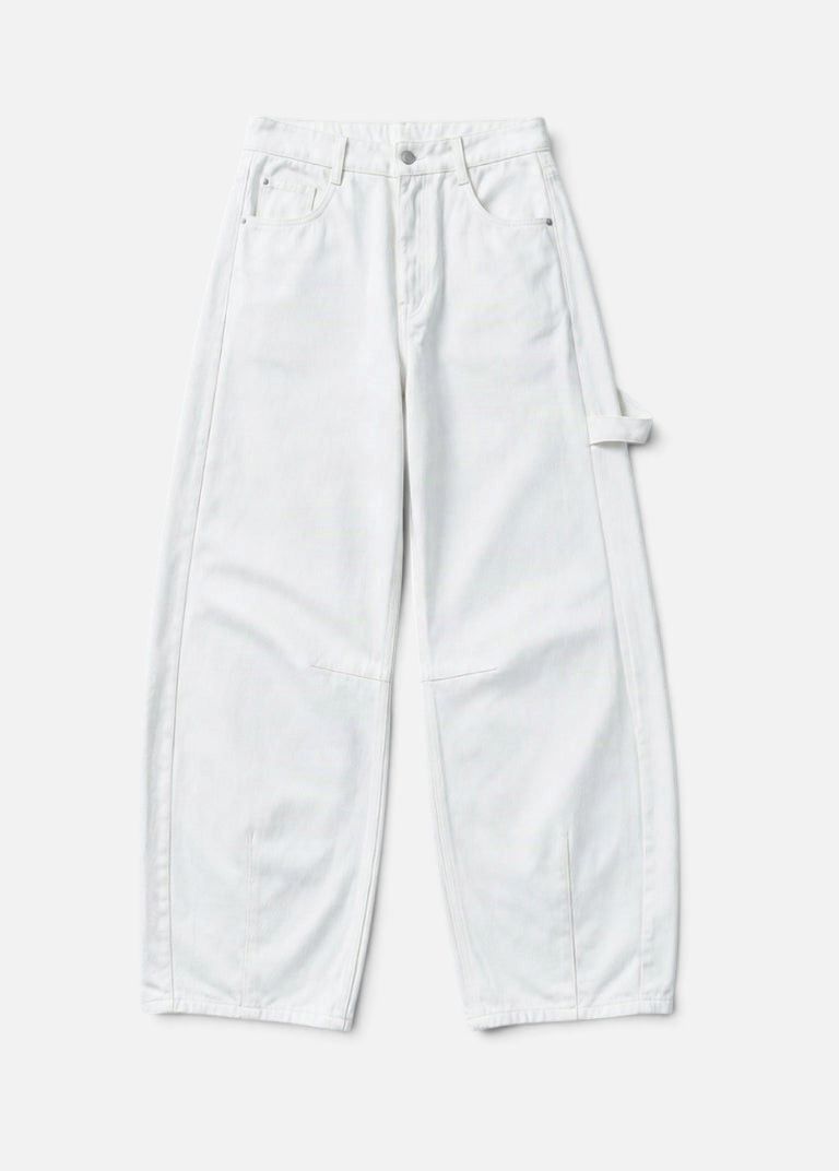 Mainstreamonline white drill pants with a loose, wide-leg fit and utility-style side loop detail.