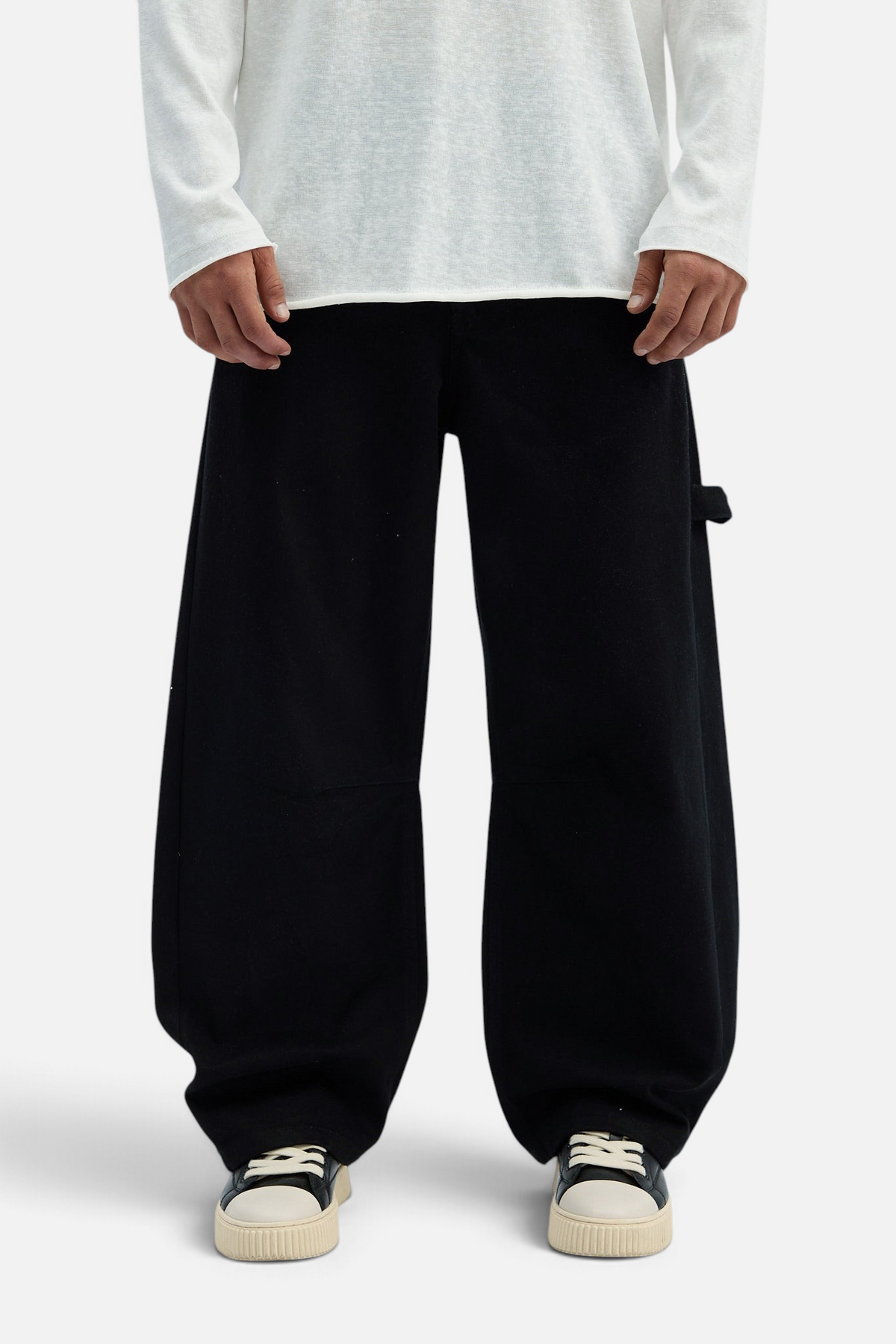 Mainstreamonline black drill pants with a loose, wide-leg fit for maximum comfort and freedom of movement.
