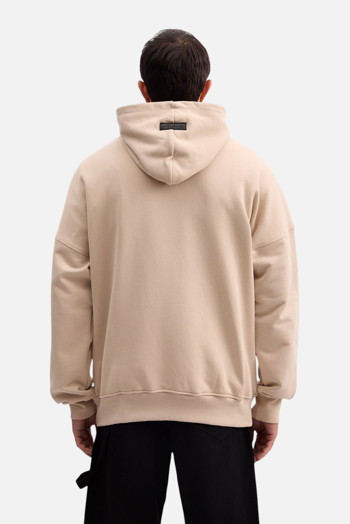 Mainstreamonline beige oversized Social Club hoodie with a relaxed fit and back hood label, worn by a man.