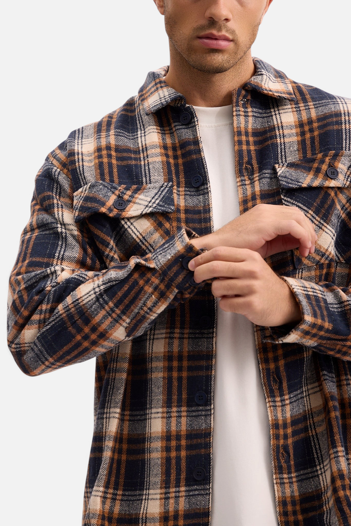 Mainstreamonline plaid jacket in navy and brown with button-up front and chest pockets worn over a white t-shirt