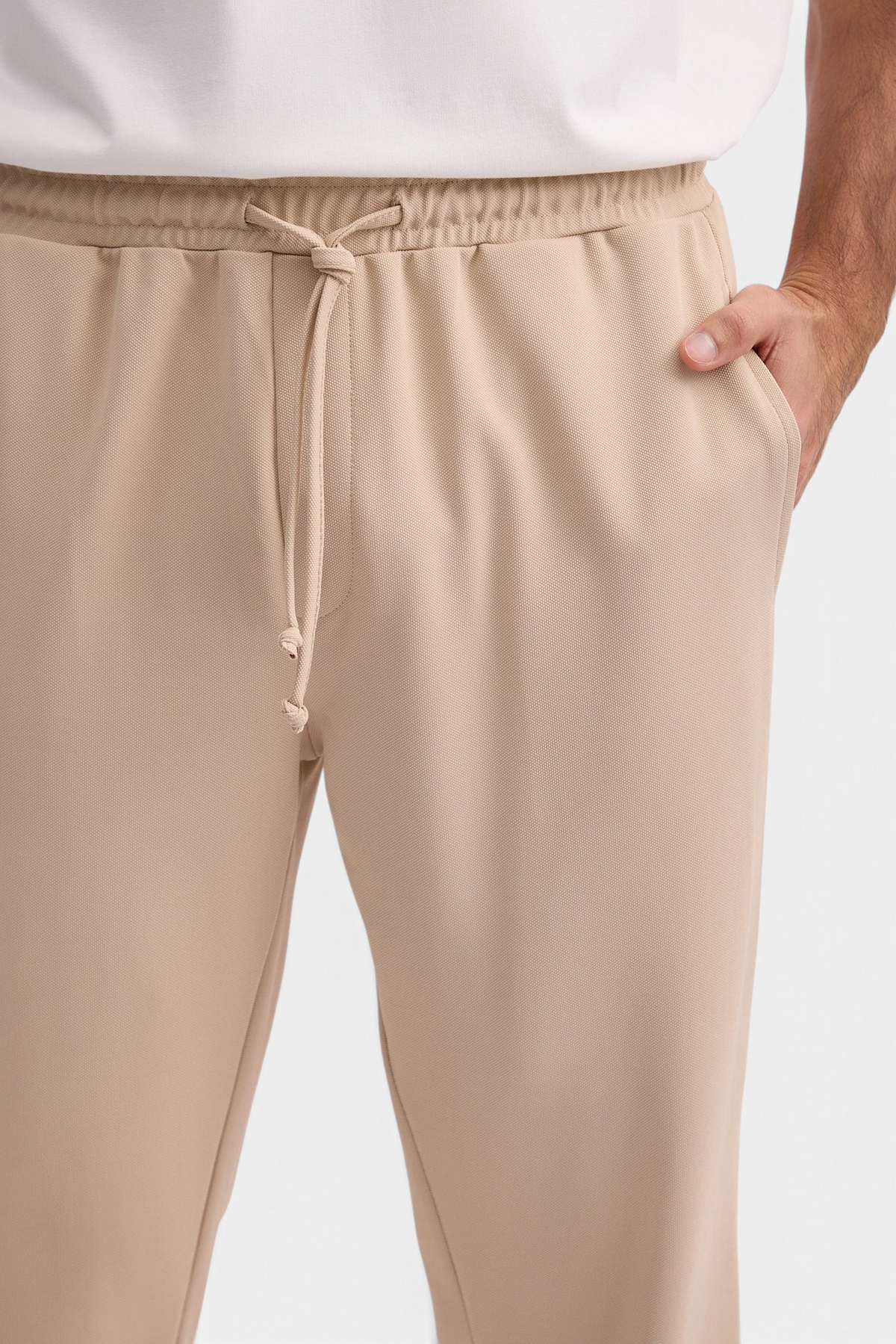 Mainstreamonline beige casual Sol Pants with elastic drawstring waist and side pockets on a model