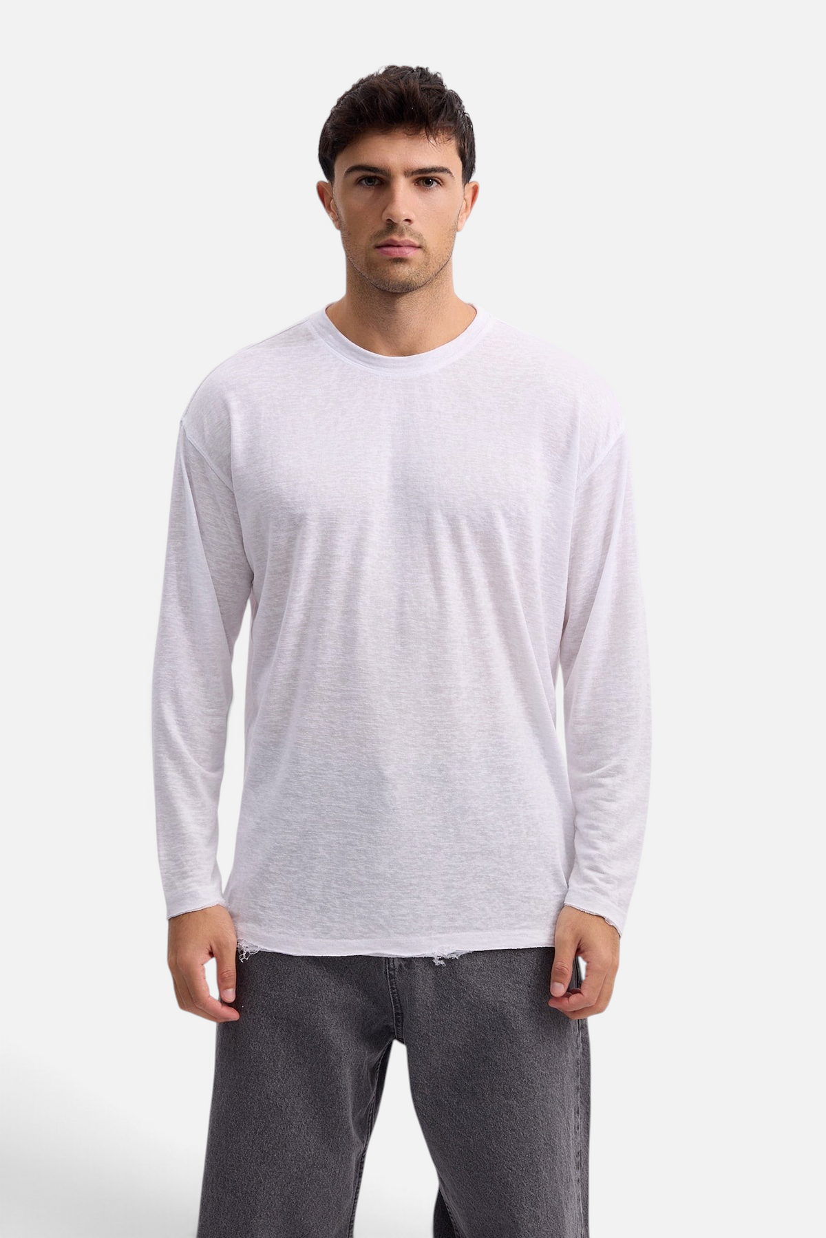 Mainstreamonline white long sleeve linen slub t-shirt with a relaxed oversized fit worn by a male model