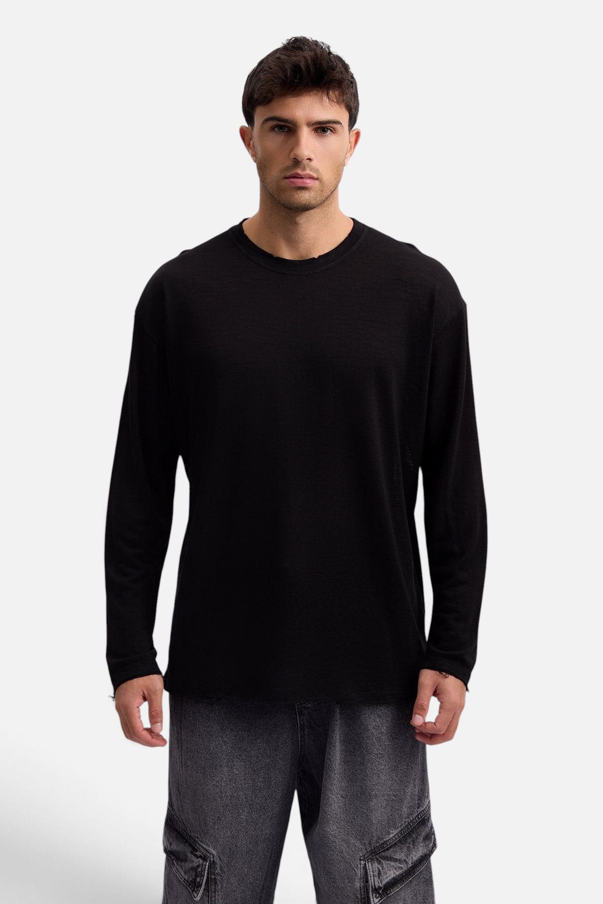 Mainstreamonline black long sleeve linen slub t-shirt with a relaxed oversized fit worn by a male model
