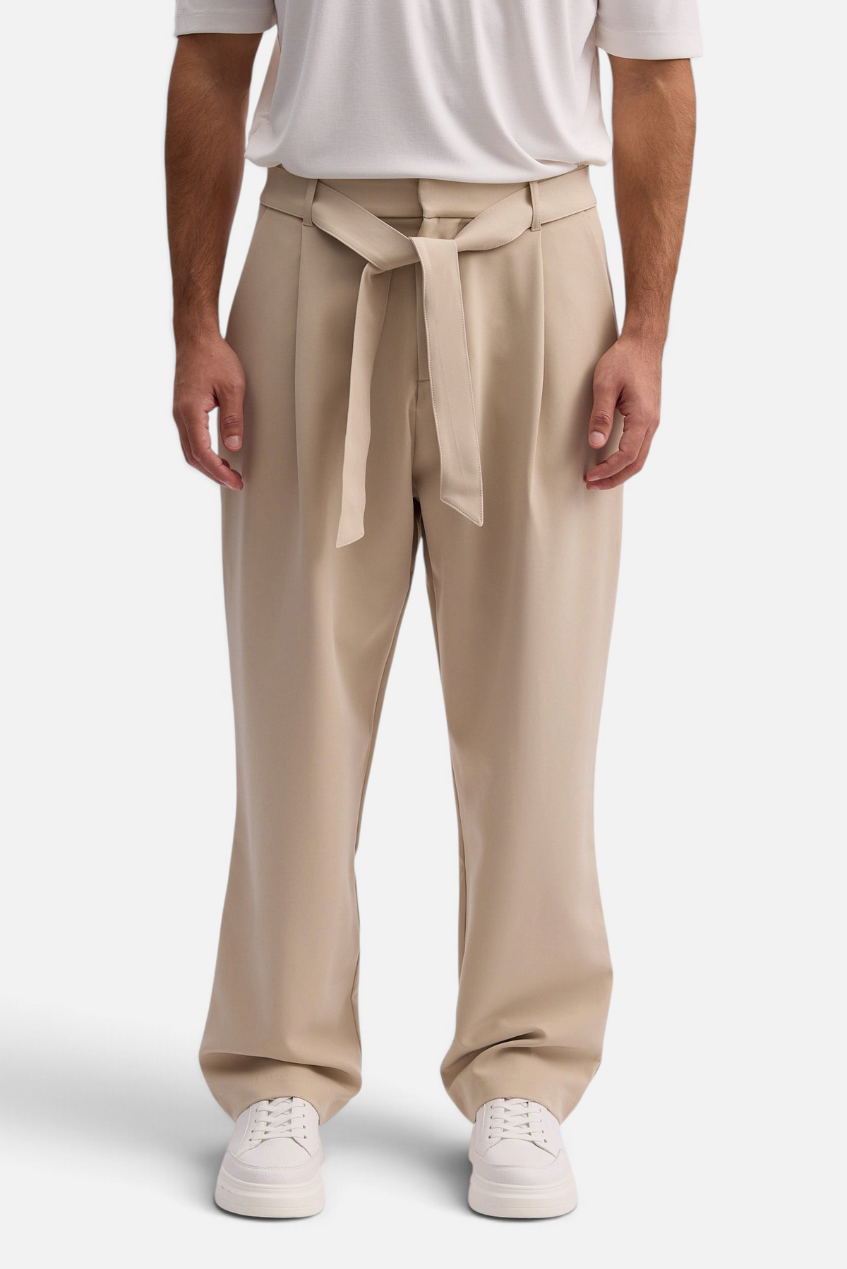Mainstreamonline beige wide-leg Torino pants with a tie-waist detail worn by a man with a white t-shirt