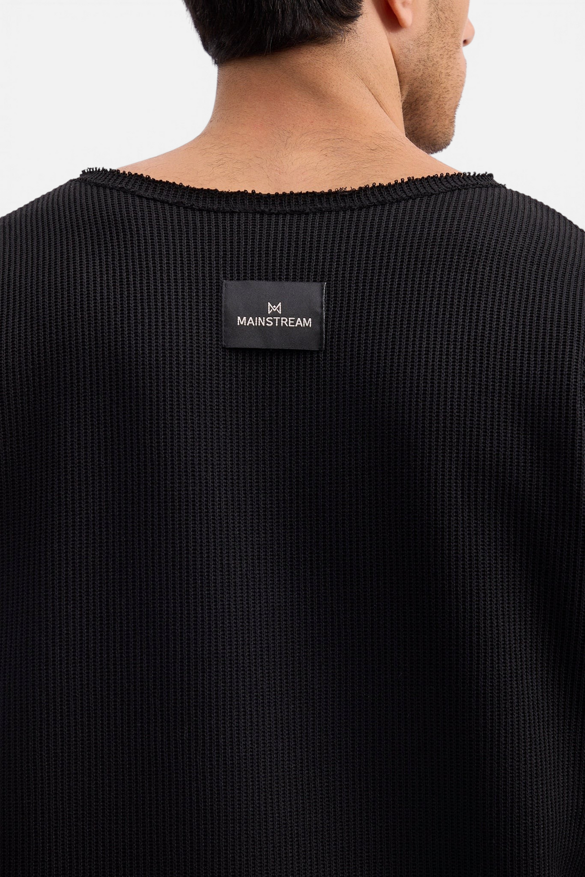 Mainstreamonline Sean Knit black oversized sweater with raw edge neckline and branded back label