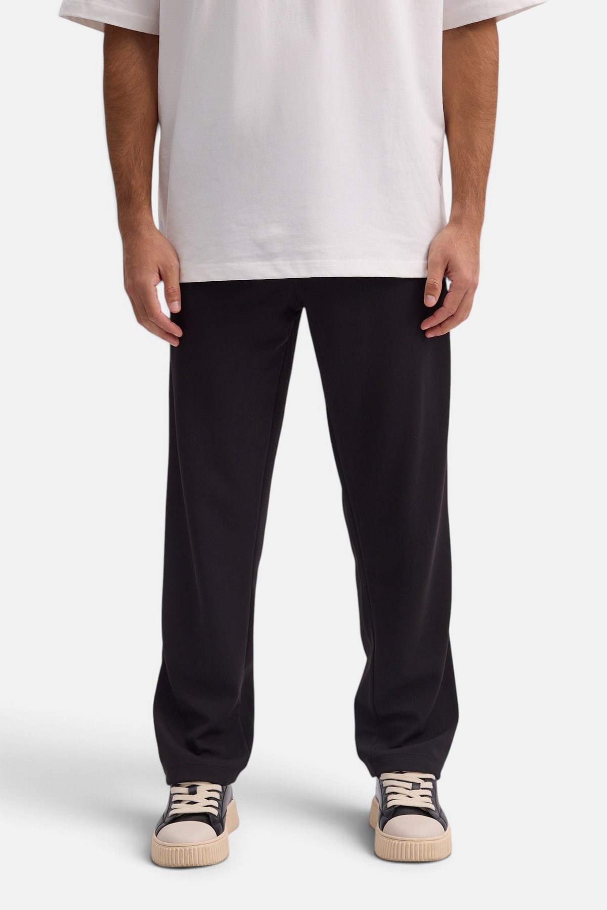 Mainstreamonline Sol Pants in black with a straight, relaxed fit, elastic waistband, and side pockets.