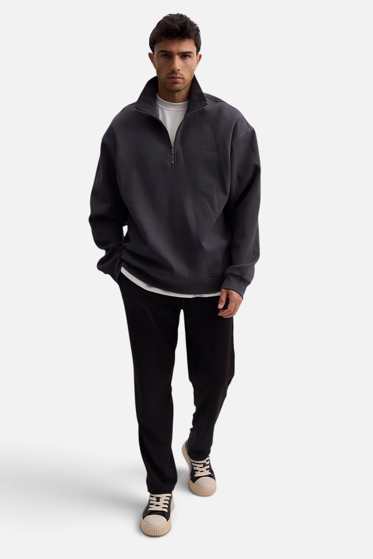 Mainstreamonline Sol Pants in black with a straight loose fit, elastic waist, and side pockets on a male model