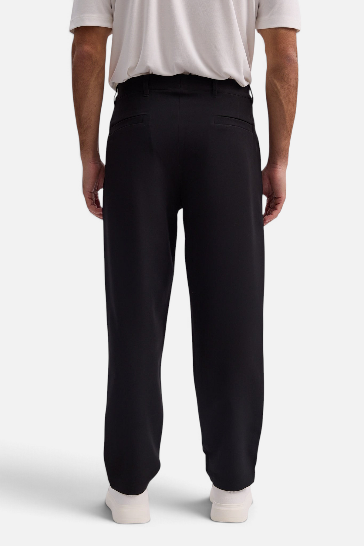 Mainstreamonline Santo Pants in black, featuring a loose, wide-leg tailored fit viewed from the back.