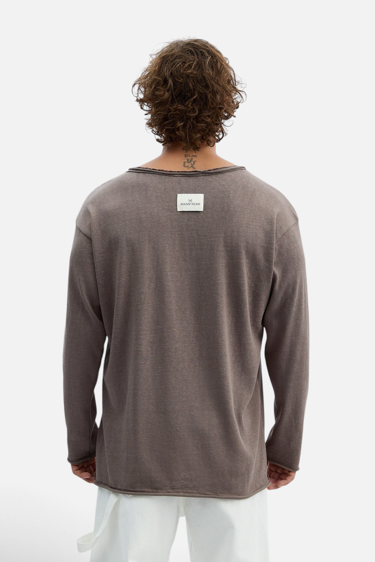 Mainstreamonline long sleeve oversized Bali t-shirt in brown with raw edge neckline and back brand label