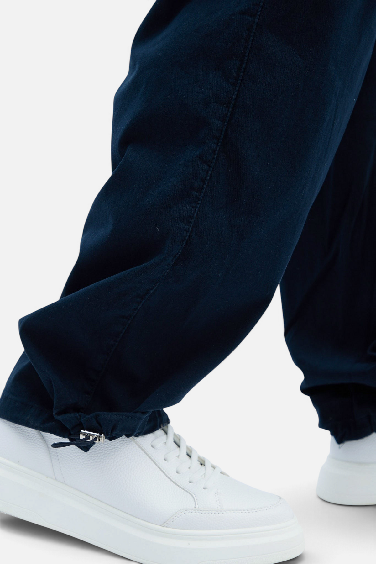 Mainstreamonline baggy jeans in dark navy blue with a loose fit and adjustable drawstring hem detail