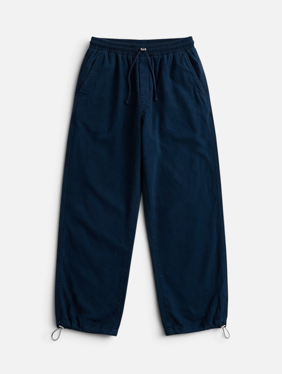 Mainstreamonline dark blue baggy jeans with a relaxed wide-leg fit, elastic drawstring waist, and toggle cuffs.