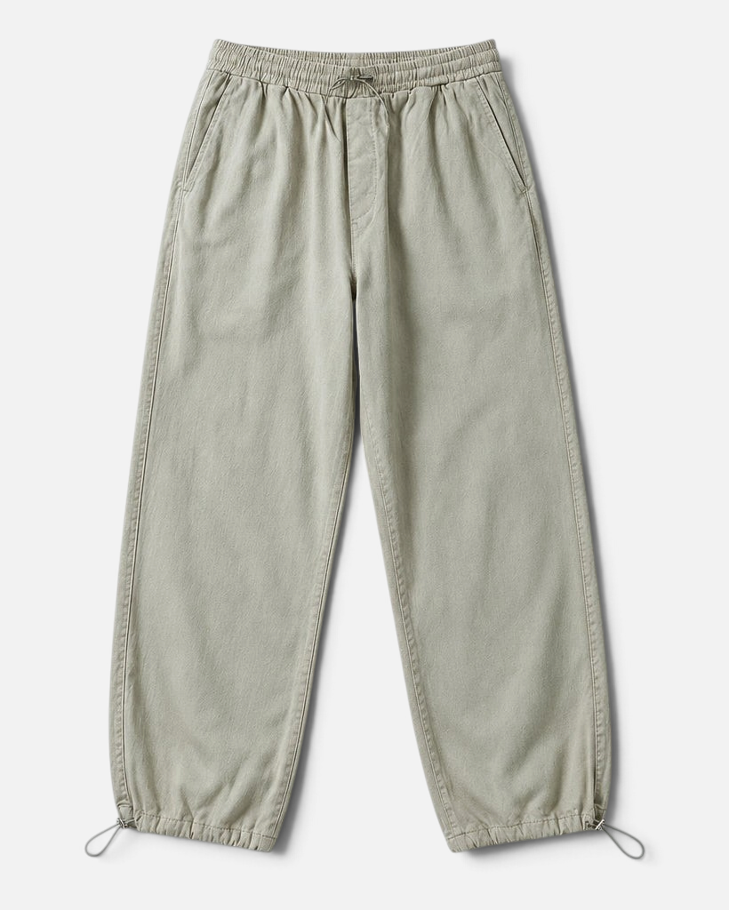 Mainstreamonline baggy jeans in light grey with an elasticated drawstring waist and adjustable toggle cuffs.
