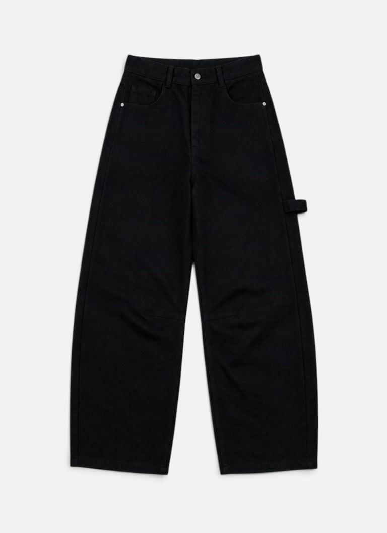 Mainstreamonline black drill pants with a loose, wide-leg fit and utility-style side loop on a plain background.