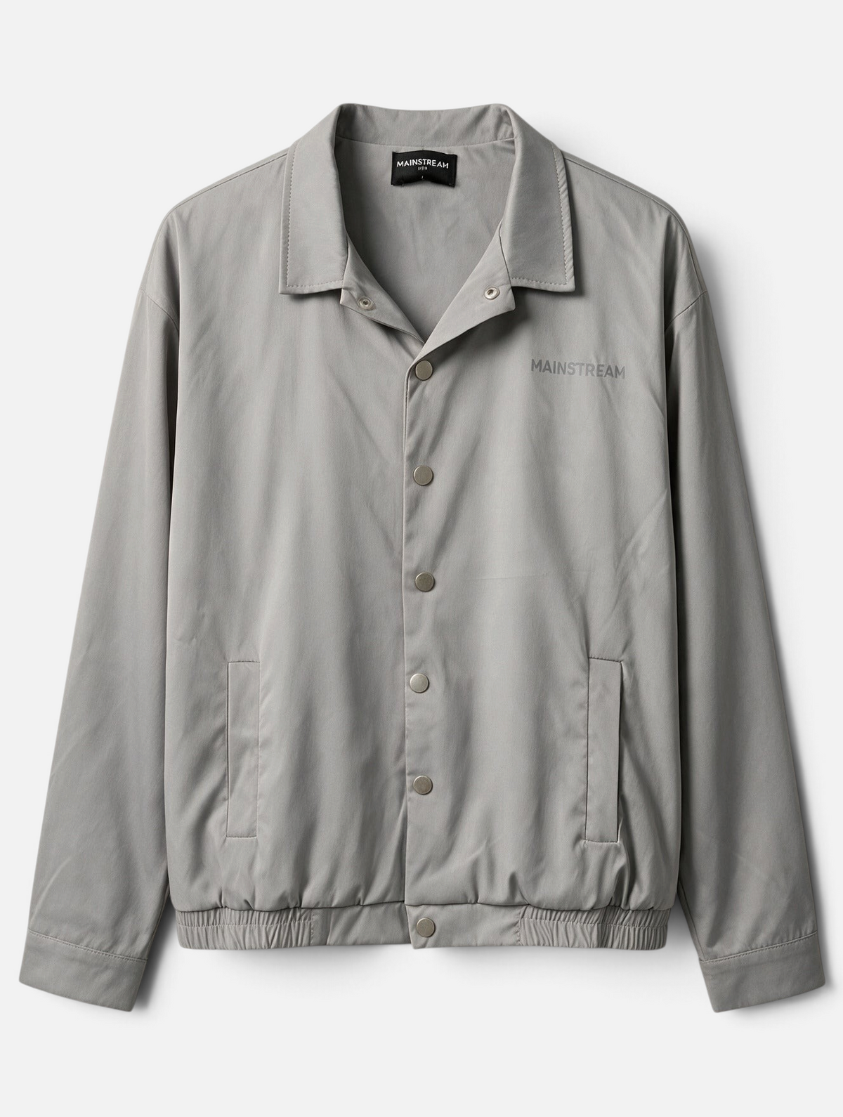 Mainstreamonline grey nylon coach jacket with a classic straight fit, snap button closure, and collar.