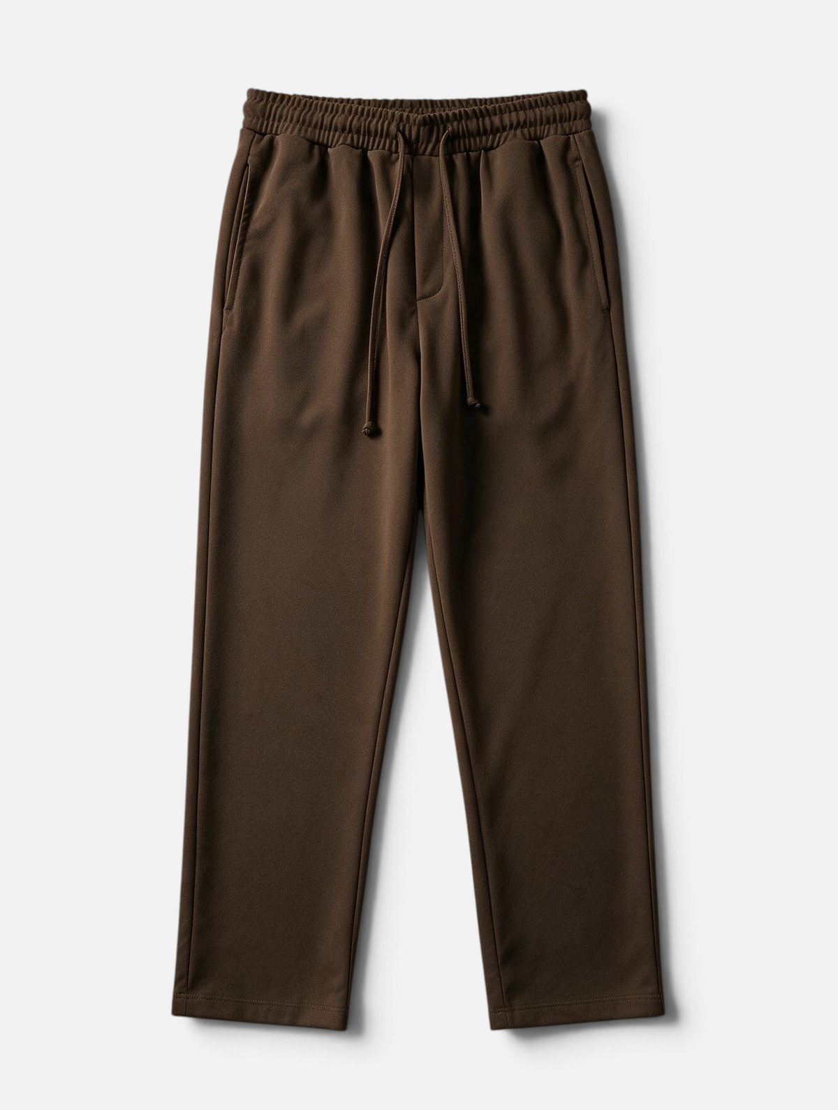 Mainstreamonline Sol Pants in dark brown featuring a relaxed straight fit, elastic waistband, and drawstring closure.