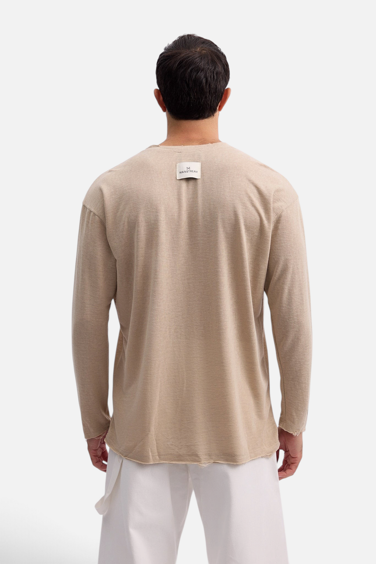 Mainstreamonline beige linen long sleeve t-shirt with an oversized fit and raw hem detail, back view