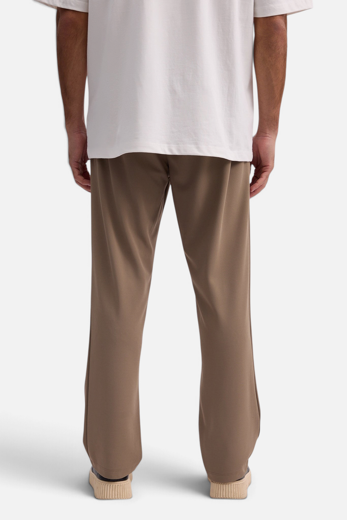 Mainstreamonline Sol Pants in brown with a relaxed straight-leg fit, elastic waist, and clean minimalist design.
