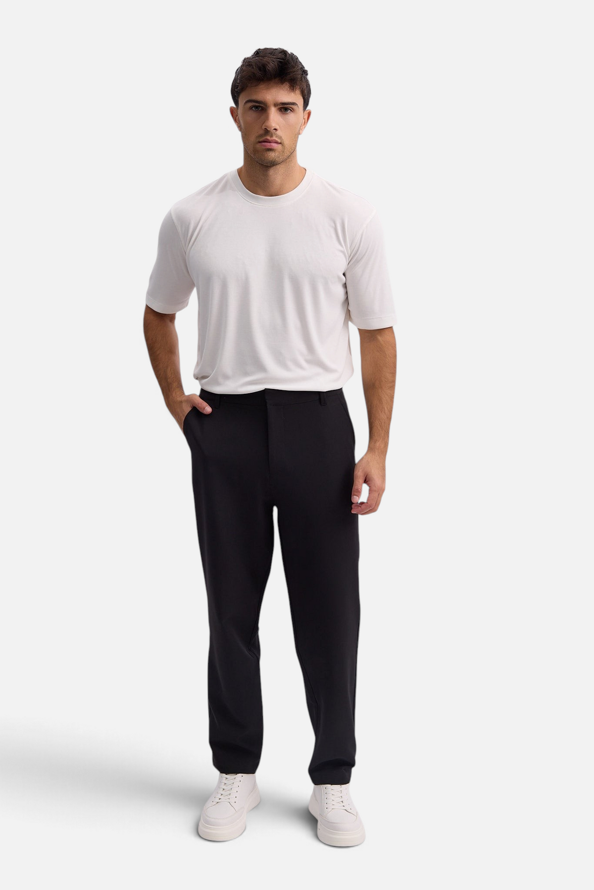 Mainstreamonline Santo Pants in black with a wide-leg, loose-fit silhouette worn by a model with a white t-shirt