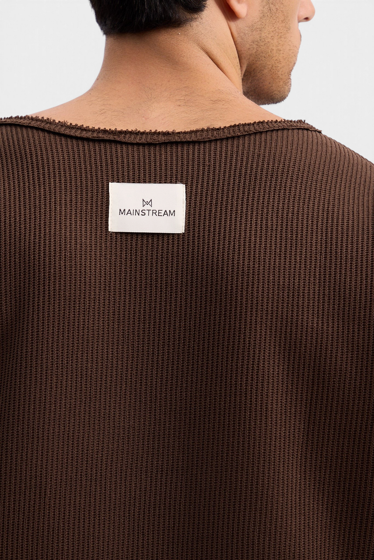 Mainstreamonline Sean Knit oversized brown sweater with raw edge neckline and branded label on the back