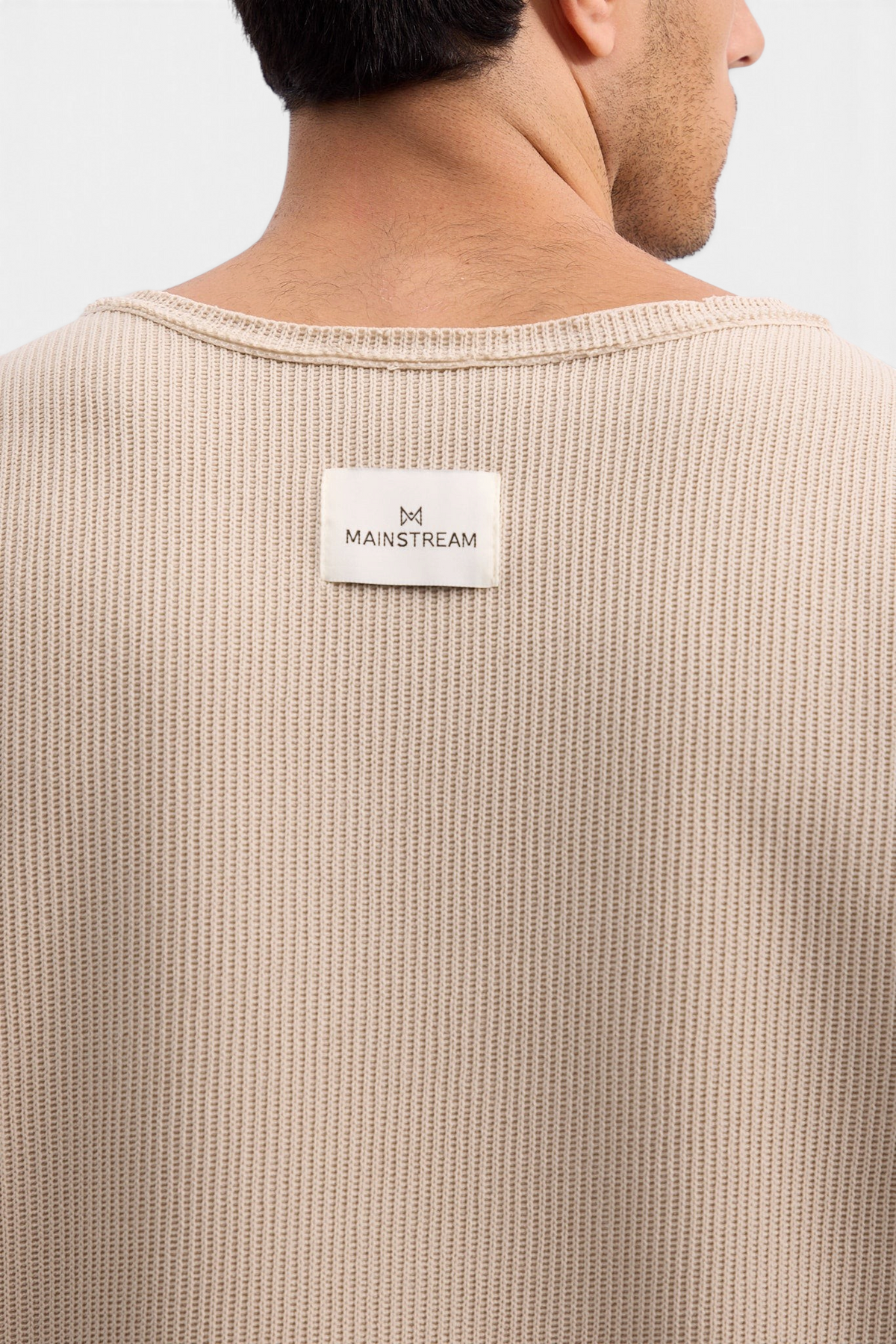 Mainstreamonline Sean Knit sweater in beige with a ribbed texture and branded label on the back neckline