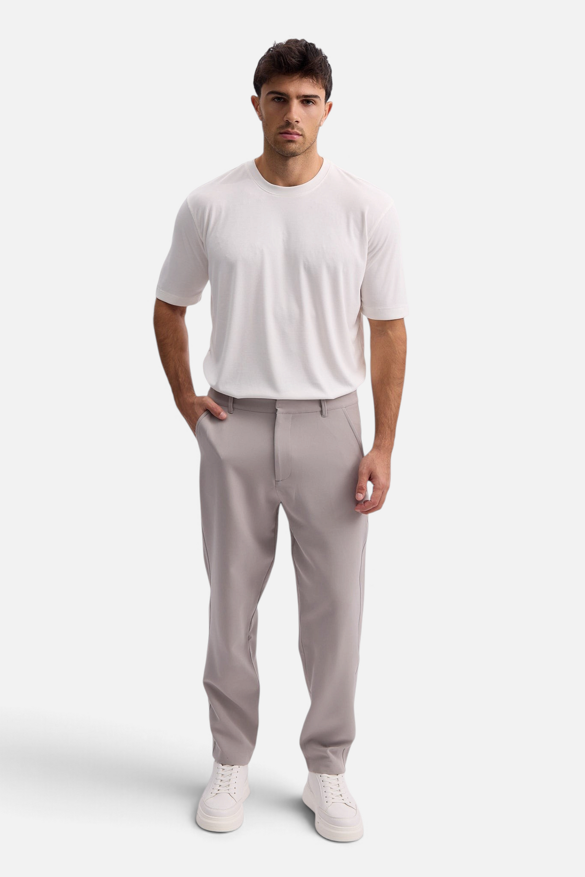 Mainstreamonline Santo Pants in light grey, featuring a relaxed wide-leg tailored fit worn by a male model.