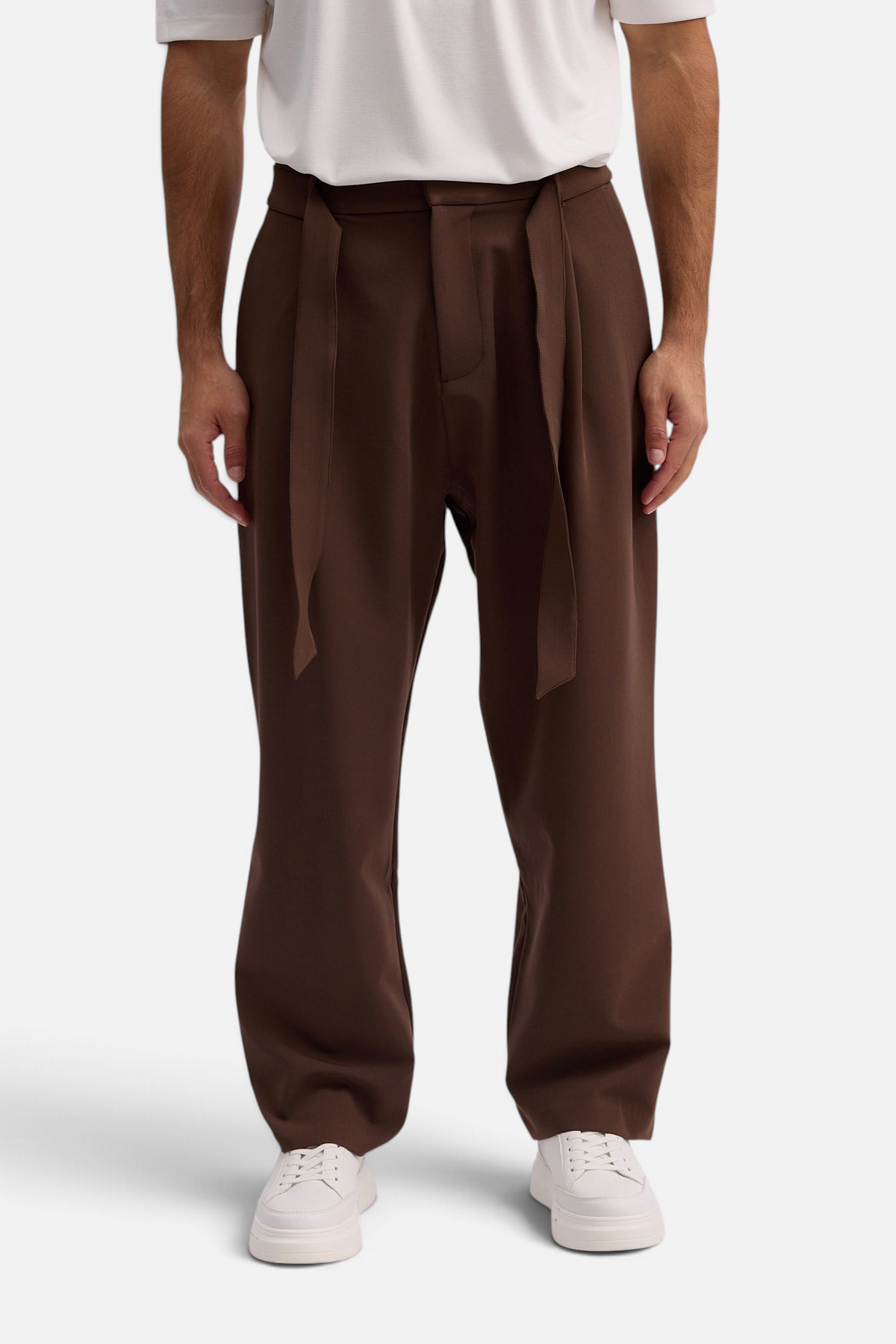 Mainstreamonline Torino wide-leg brown trousers with a tie-waist detail worn by a man with a white t-shirt
