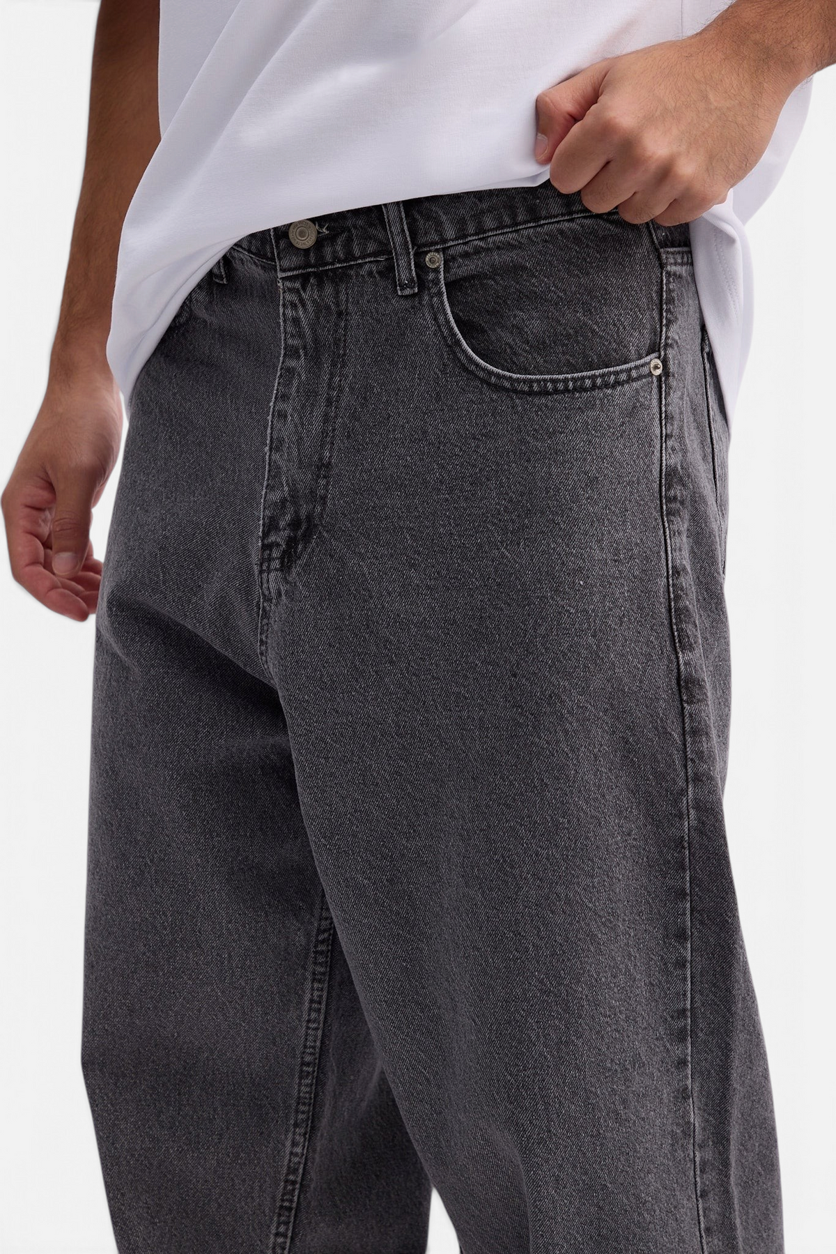Mainstreamonline charcoal grey baggy skater jeans with a loose, relaxed fit worn by a model in a white t-shirt.