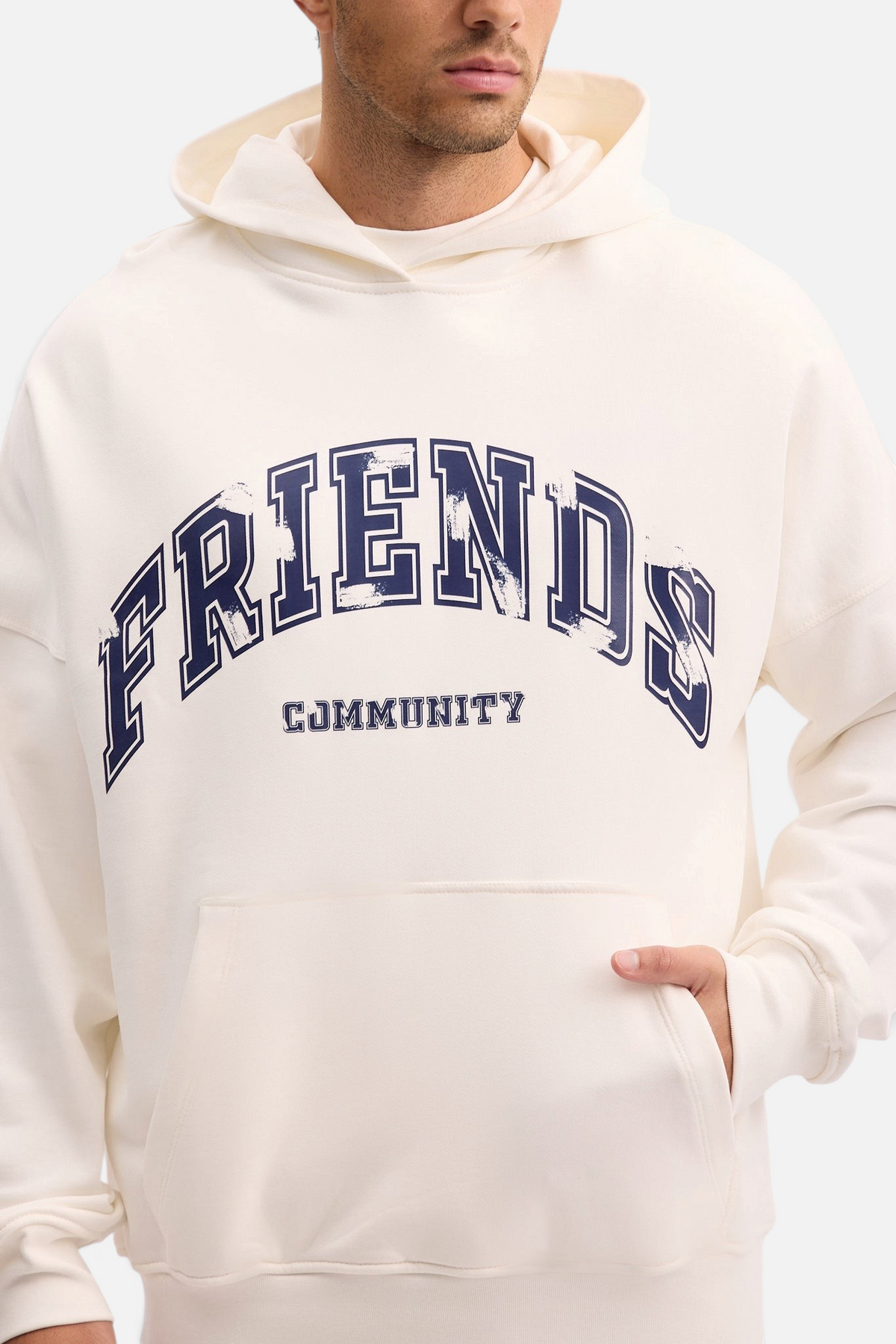 Mainstreamonline oversized cream hoodie with navy blue Friends Community graphic print and front kangaroo pocket