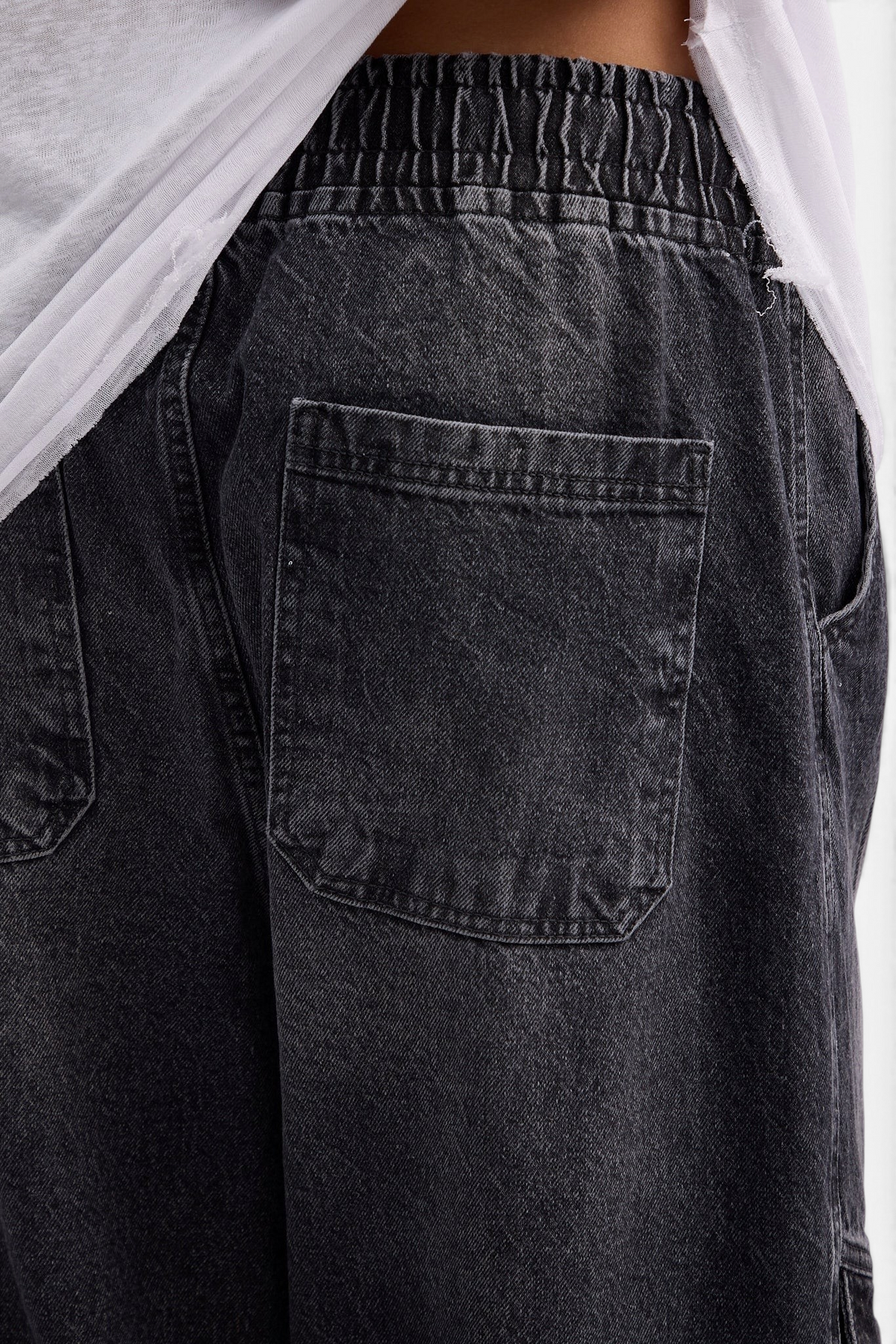 Mainstreamonline baggy skater jeans in washed black denim with an elasticated waistband and back pocket detail