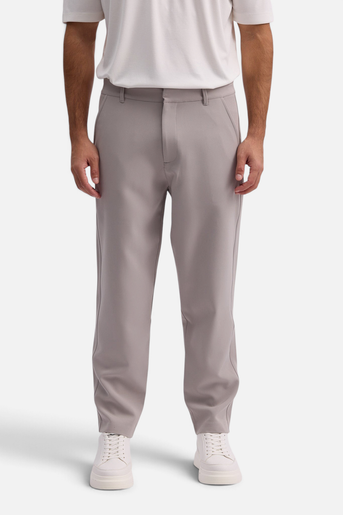 Mainstreamonline Santo Pants in light grey, featuring a relaxed wide-leg tailored fit on a male model.