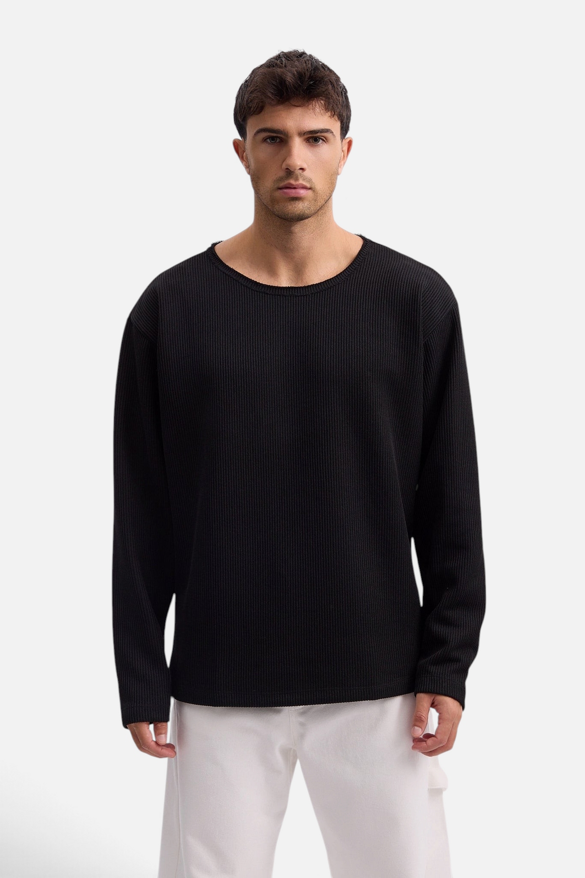 Mainstreamonline Sean Knit black oversized long-sleeve sweater worn by a male model with a ribbed texture
