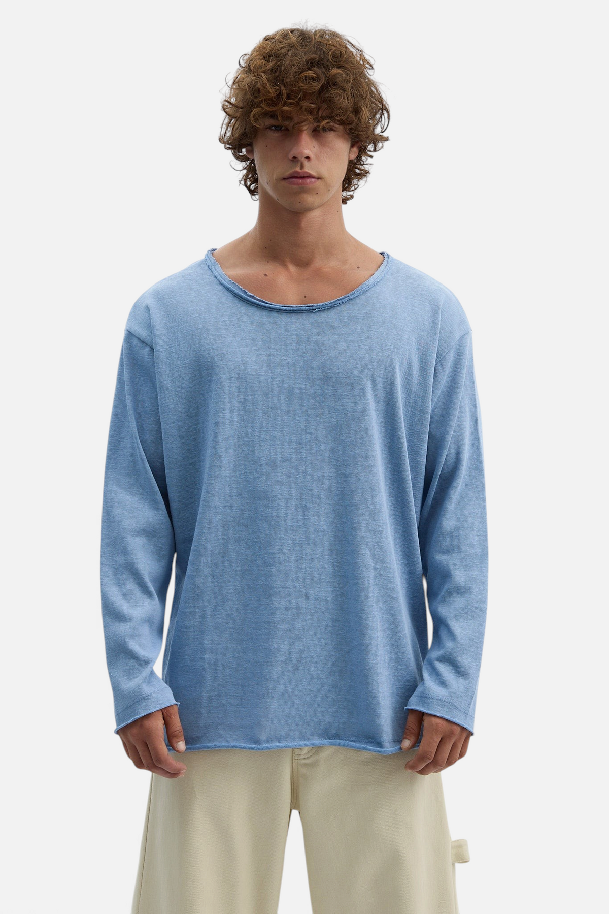 Mainstreamonline blue long sleeve oversized t-shirt with a raw edge neckline worn by a male model