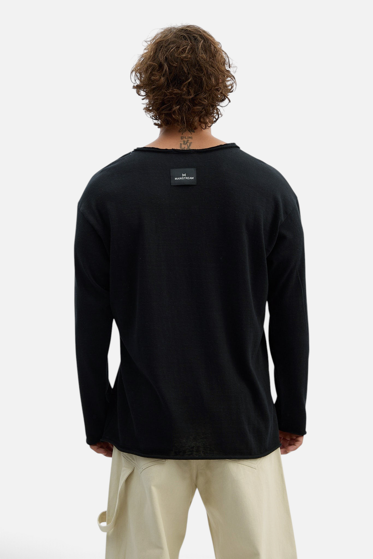 Mainstreamonline black long sleeve oversized t-shirt with raw edge neckline and brand label on back