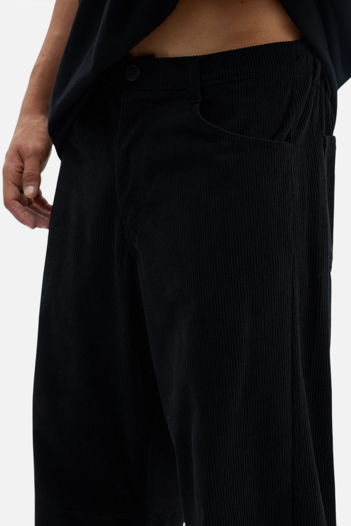 Mainstreamonline black corduroy baggy pants with a loose, relaxed fit for comfortable movement.