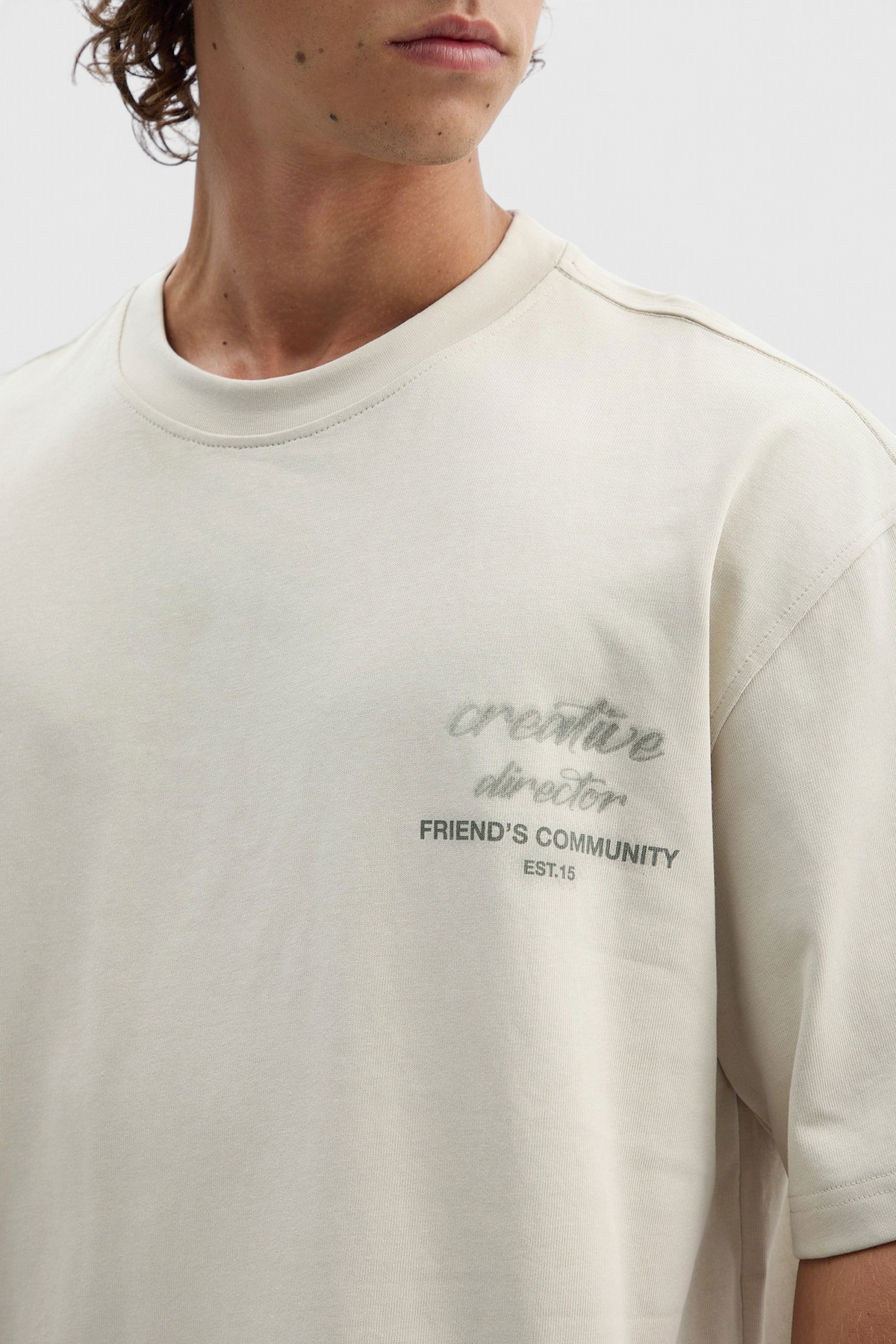 Mainstreamonline beige oversized t-shirt with creative director graphic print on chest, relaxed fit cotton crew neck