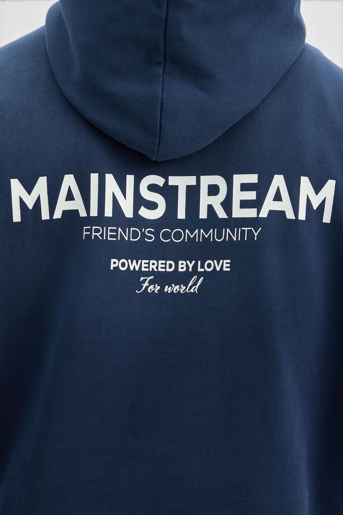 Mainstreamonline navy blue oversized hoodie with white graphic text print on the back