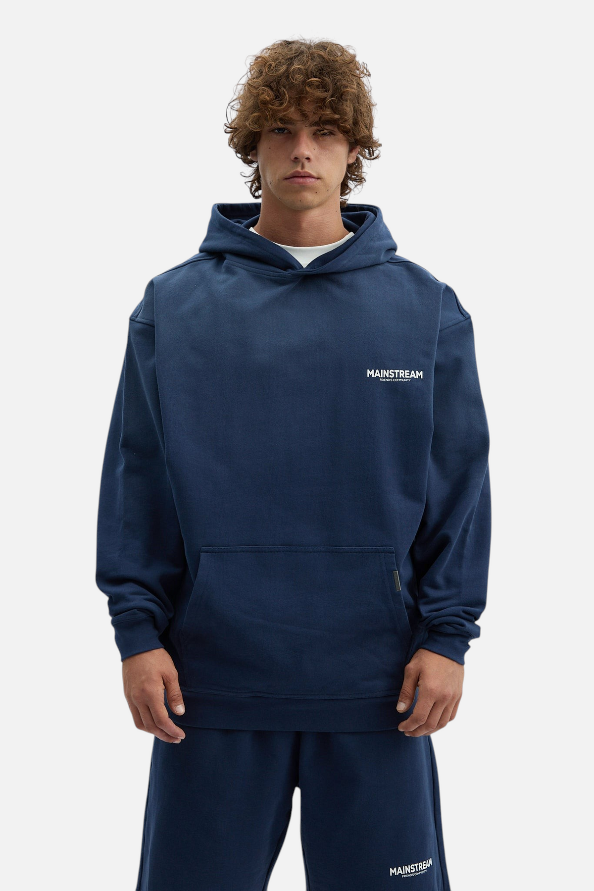 Mainstreamonline oversized navy blue hoodie with a relaxed fit and small white logo on the chest