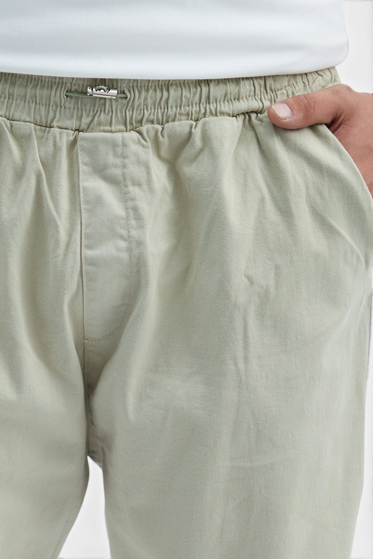 Mainstreamonline baggy jeans in light sage green with an elasticated drawstring waistband and side pocket